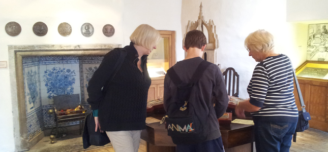 Family completing an activitiy in John Knox House